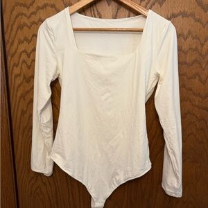 Elegant Cream Long Sleeve Bodysuit